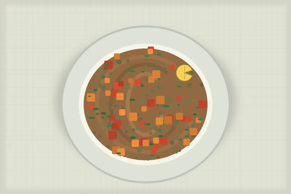 Bowl of herby lentil soup with lemon and parsley