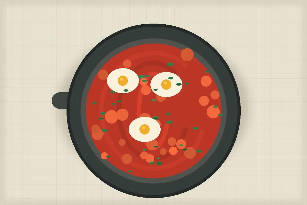 Skillet of roasted tomato shakshuka with herbs